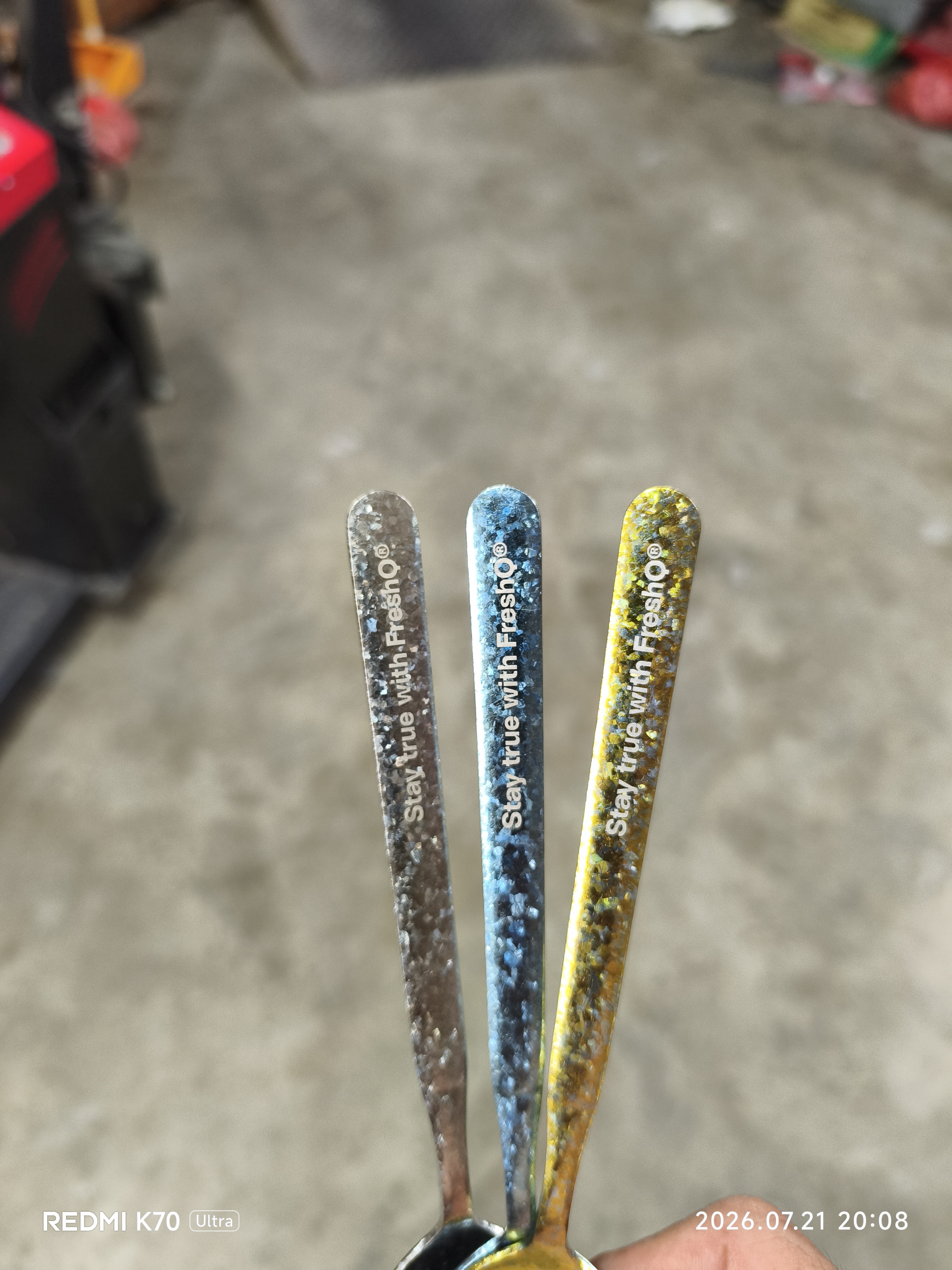 Finished customized spoon handles with customer logo on white background